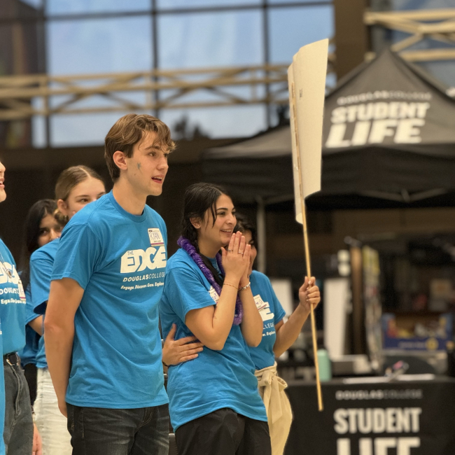 Students using blue t-shirt with a surprise expression on their faces